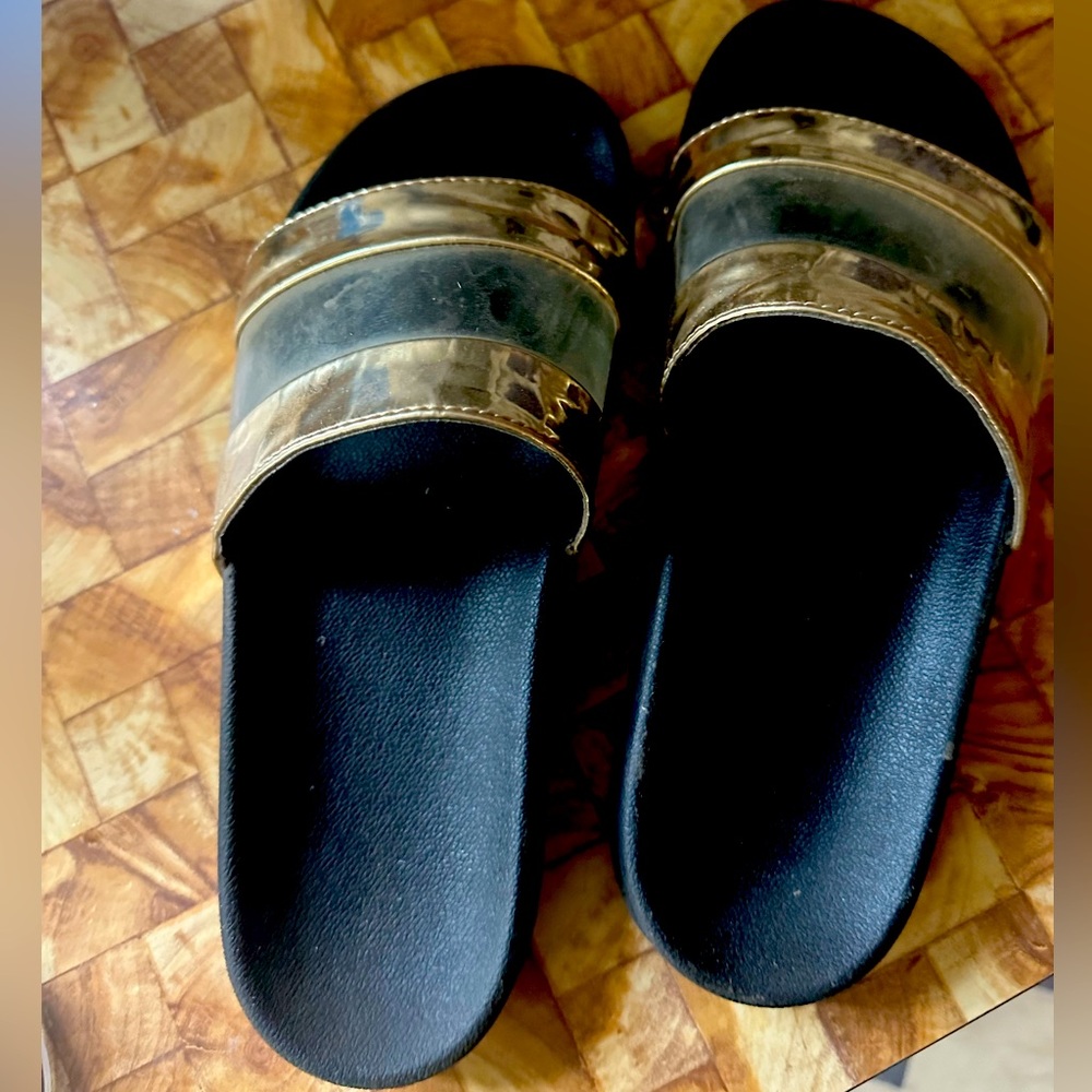 Size 8 women’s black, gold, clear slides